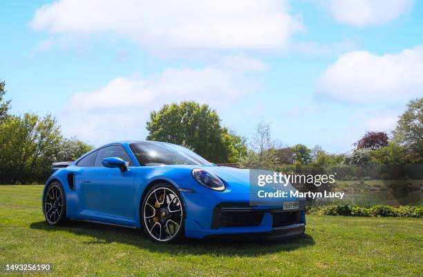 The Porsche 911 Turbo S seen at Petrolheadonism Cars and Copters Event in Bedfordshire. Every year, Petrolheadonism host a cars and copters event to...
