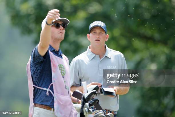 Spencer Cross of the United States and his caddie check wind direction on the second hole during the first round of the Visit Knoxville Open at...