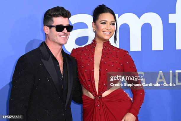 Robin Thicke and April Love Geary attend the amfAR Cannes Gala 2023 at Hotel du Cap-Eden-Roc on May 25, 2023 in Cap d'Antibes, France.