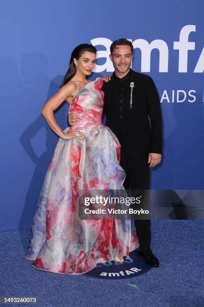 Amy Jackson and Ed Westwick attend the amfAR Cannes Gala 2023 where guests sipped Clase Azul Tequila at Hotel du Cap-Eden-Roc on May 25, 2023 in Cap...