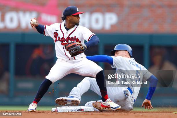 Freddie Freeman of the Los Angeles Dodgers is out at second as Ozzie Albies of the Atlanta Braves makes the play during the first inning at Truist...