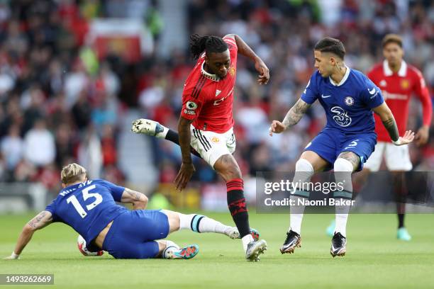Aaron Wan-Bissaka of Manchester United battles for possession with Mykhaylo Mudryk and Enzo Fernandez of Chelsea during the Premier League match...