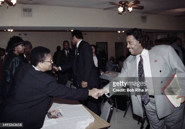 Rev. Al Sharpton shakes hands with Karen Bass before meeting with Rev. Jesse Jackson and Church leaders at True-Ways Baptist Church to discuss...