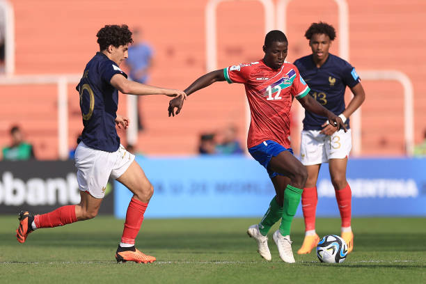 Muhammed Jobe of Gambia drives the ball against Soungoutou Magassa of France during the FIFA U-20 World Cup Argentina 2023 Group F match between...