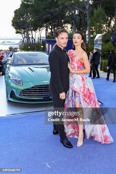 Ed Westwick and Amy Jackson are pictured with the new Aston Martin DB12 during the amfAR Cannes Gala 2023 at Hotel du Cap-Eden-Roc on May 25, 2023 in...