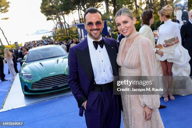 Alessandro Martorana and Elena Barolo are pictured with the new Aston Martin DB12 during the amfAR Cannes Gala 2023 at Hotel du Cap-Eden-Roc on May...