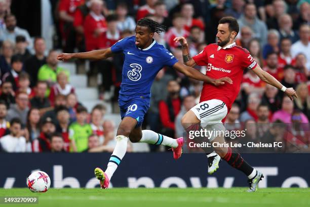 Carney Chukwuemeka of Chelsea battles for possession with Bruno Fernandes of Manchester United during the Premier League match between Manchester...