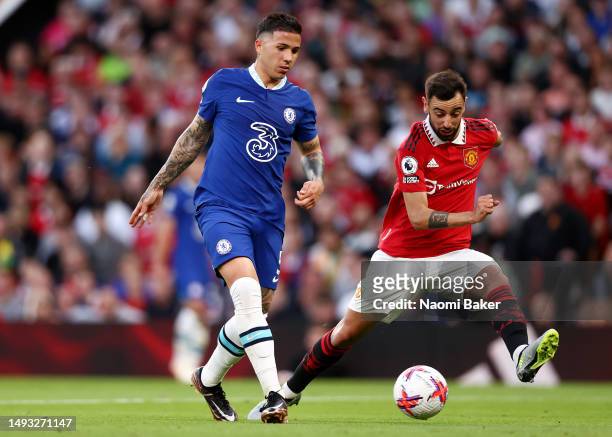 Enzo Fernandez of Chelsea makes a pass whilst under pressure from Bruno Fernandes of Manchester United during the Premier League match between...