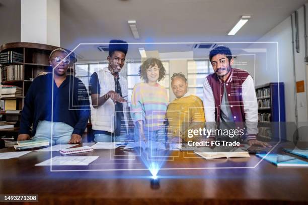 university students using augmented reality device to study at library - data science stock pictures, royalty-free photos & images