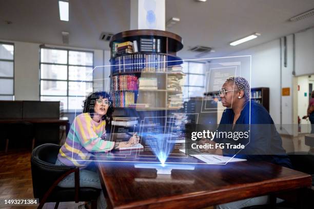 university students using augmented reality device to study at library - digital library stock pictures, royalty-free photos & images