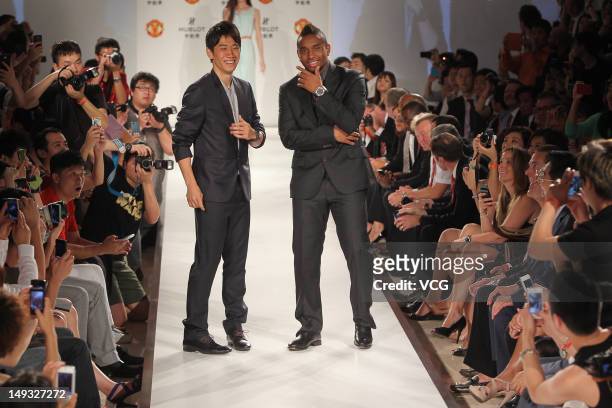 Shinji Kagawa and Anderson of Manchester United pose during a Hublot Charity Dinner and Fashion Show event in aid of the MU Foundation at Shangri-La...