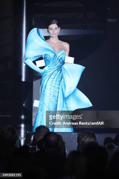 Isabeli Fontana walks the runway during the amfAR Cannes Gala 2023 at Hotel du Cap-Eden-Roc on May 25, 2023 in Cap d'Antibes, France.