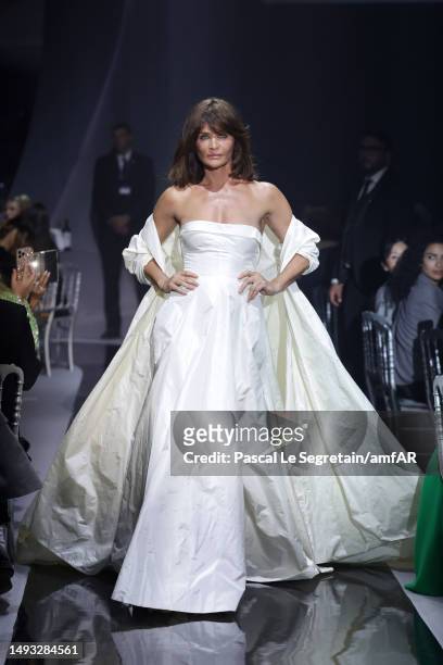 Helena Christensen walks the runway during the amfAR Cannes Gala 2023 at Hotel du Cap-Eden-Roc on May 25, 2023 in Cap d'Antibes, France.