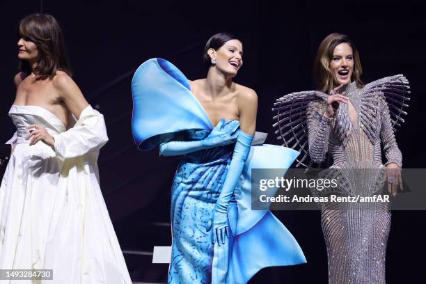 Helena Christensen, Isabeli Fontana and Alessandra Ambrosio walk the runway during the amfAR Cannes Gala 2023 at Hotel du Cap-Eden-Roc on May 25,...