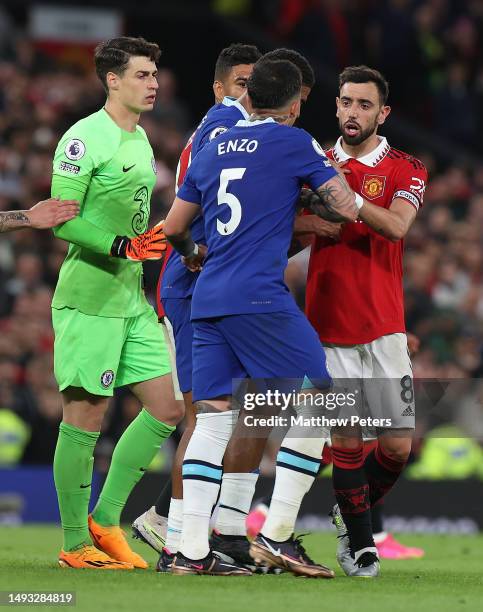 Bruno Fernandes of Manchester United clashes with Enzo Fernandez of Chelsea during the Premier League match between Manchester United and Chelsea FC...