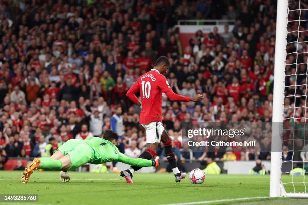 Marcus Rashford of Manchester United scores the team's fourth goal past Kepa Arrizabalaga of Chelsea during the Premier League match between...