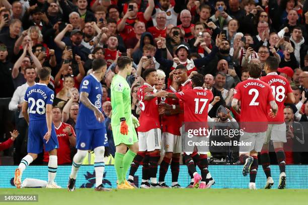 Bruno Fernandes of Manchester United celebrates with Jadon Sancho, Alejandro Garnacho and Marcus Rashford after scoring the team's third goal from a...