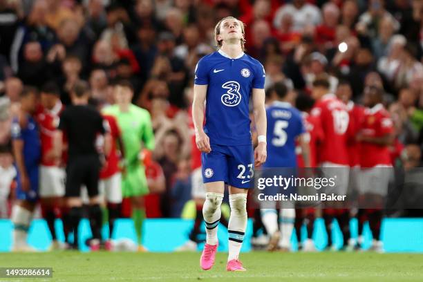 Conor Gallagher of Chelsea looks dejected after Bruno Fernandes of Manchester United scores the team's third goal from a penalty kick during the...