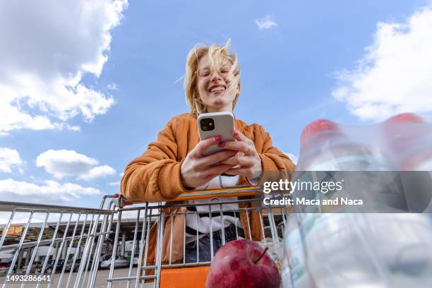 low angle view from a shopping cart - young woman trolley stock pictures, royalty-free photos & images