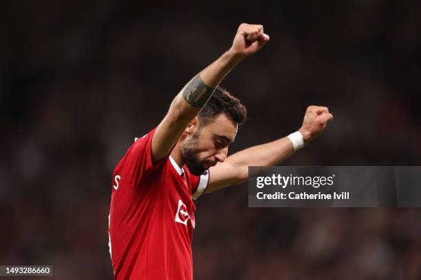 Bruno Fernandes of Manchester United celebrates their side's fourth goal scored by team mate Marcus Rashford during the Premier League match between...