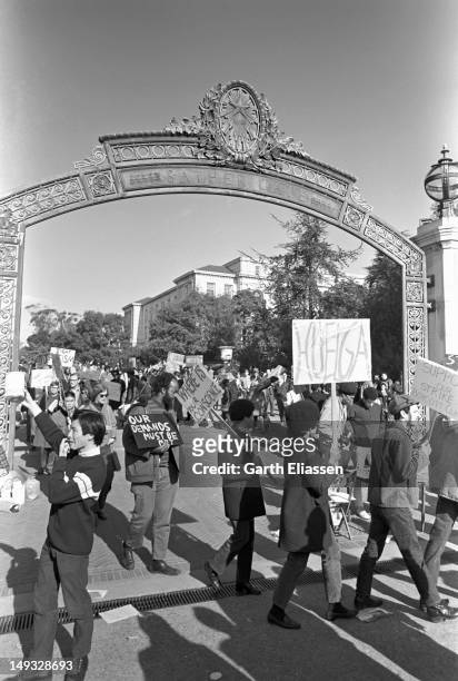 Student demonstrators walk in a picket line at the Sather Gate entrance to the University of California, Berkeley, California, early 1969. Student...