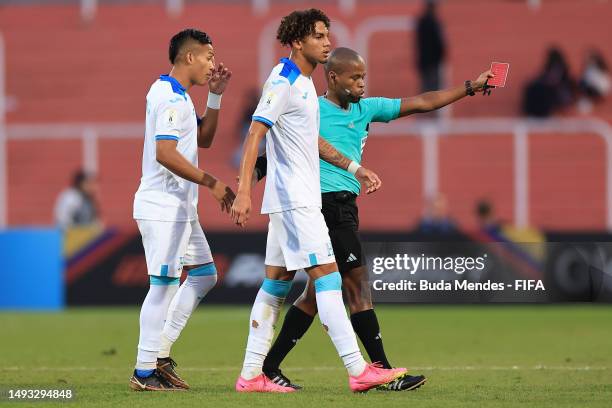 Referee Abongile Tom leads out David Ochoa of Honduras due to a red card during the FIFA U-20 World Cup Argentina 2023 Group F match between Korea...