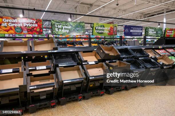 Empty shelves during a national shortage of certain fruit and vegetables such as tomatoes and peppers in an ASDA supermarket on March 11, 2023 in...