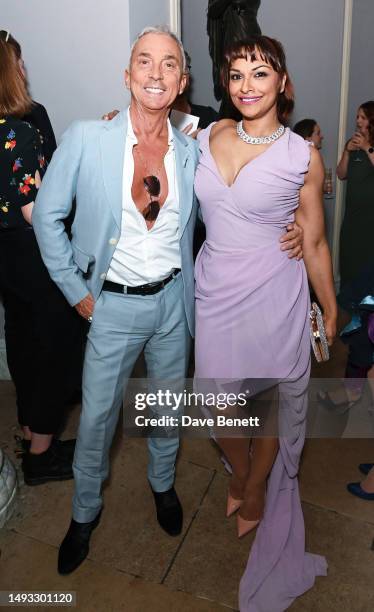Bruno Tonioli and Danielle de Niese wearing a Vivienne Westwood dress and jewellery by Van Cleef attend the "Aspects of Love" opening night post-show...