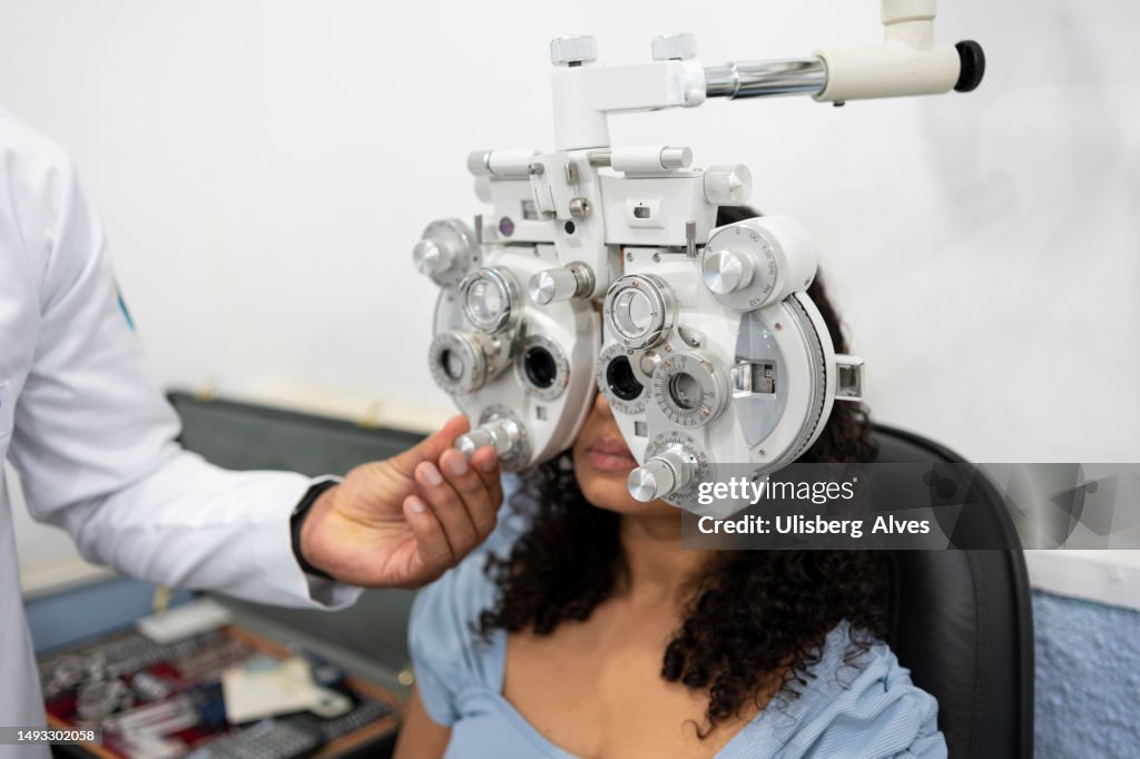 Woman Performing Vision Exam High-Res Stock Photo - Getty Images