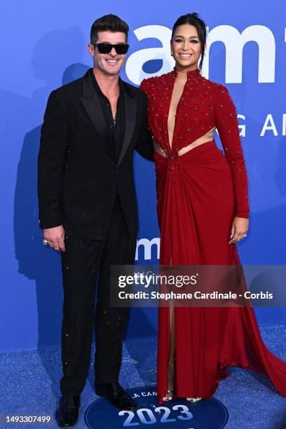 Robin Thicke and April Love Geary attend the amfAR Cannes Gala 2023 at Hotel du Cap-Eden-Roc on May 25, 2023 in Cap d'Antibes, France.