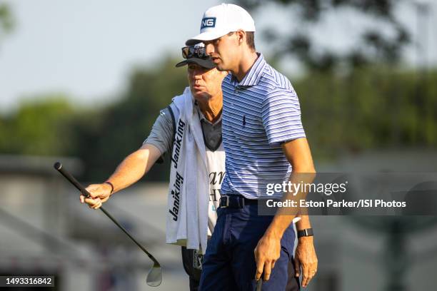 Alex Smalley of the United States and his caddie, Don Donatello, during the First Round of the Charles Schwab Challenge at Colonial Country Club on...