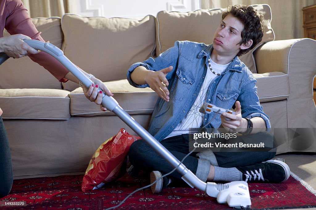 A boy's gaming interrupted by his mum's vacuuming