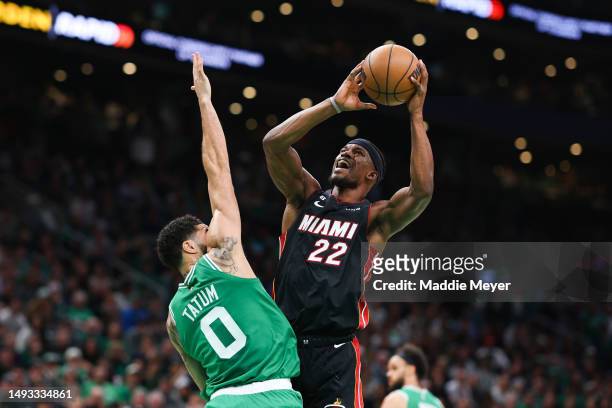 Jimmy Butler of the Miami Heat drives against Jayson Tatum of the Boston Celtics during the first quarter in game five of the Eastern Conference...