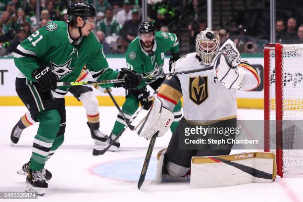 Jason Robertson of the Dallas Stars tips the puck for a goal against Adin Hill of the Vegas Golden Knights during the first period in Game Four of...