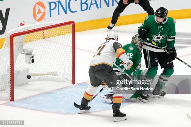 William Karlsson of the Vegas Golden Knights scores a goal behind Jake Oettinger of the Dallas Stars during the first period in Game Four of the...