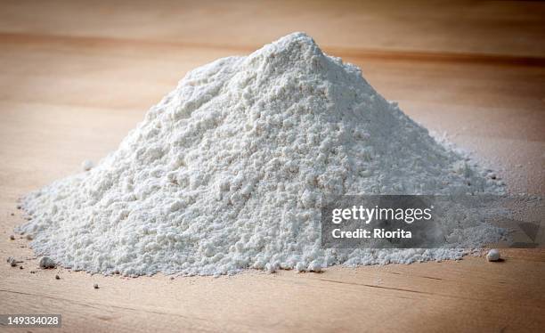 flour on the wooden table - flour stock pictures, royalty-free photos & images