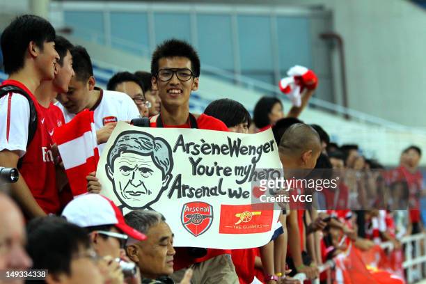 Fans of Arsenal FC during a training session during the club's pre-season Asian tour at the Olympic Sports Centre on July 26, 2012 in Beijing, China.