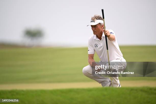 Bernhard Langer of Germany lines up a putt on the 15th green during the first round of the KitchenAid Senior PGA Championship at Fields Ranch East at...