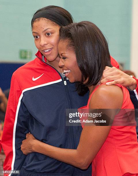 First Lady Michelle Obama meets Candace Parker of the 2012 Team USA at the University of East London on July 27, 2012 in London, England. Michelle...