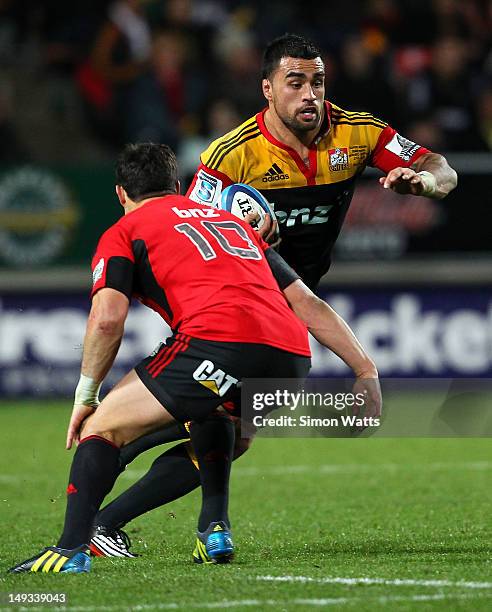 Liam Messam of the Chiefs looks to beat the tackle of Dan Carter of the Crusaders during the Super Rugby Semi Final match between the Chiefs and...