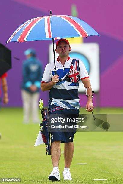 Alan Wills of Great Britain walks back after inspecting the target during the Archery Ranking Round on Olympics Opening Day as part of the London...