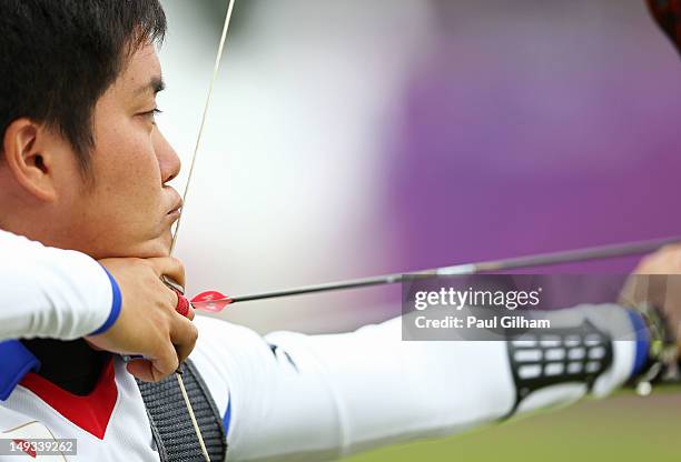 Hideki Kikuchi of Japan in action during the Archery Ranking Round on Olympics Opening Day as part of the London 2012 Olympic Games at the Lord's...