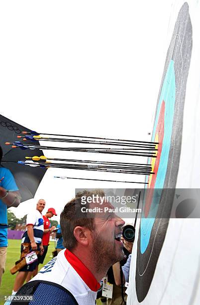 Larry Godfrey of Great Britain inspects his arrows during the Archery Ranking Round on Olympics Opening Day as part of the London 2012 Olympic Games...