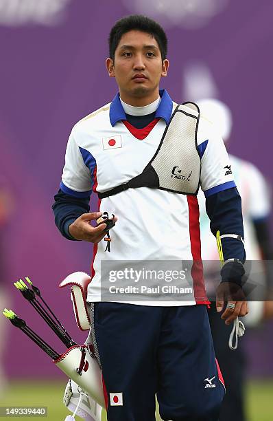 Yu Ishizu of Japan walks back after inspecting the targets during the Archery Ranking Round on Olympics Opening Day as part of the London 2012...