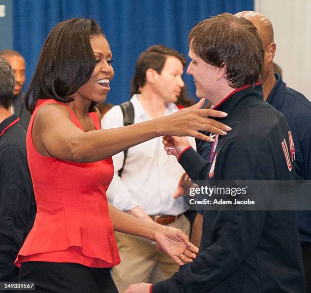 First Lady Michelle Obama greets members of the the 2012 Team USA at the University of East London on July 27, 2012 in London, England. Michelle...