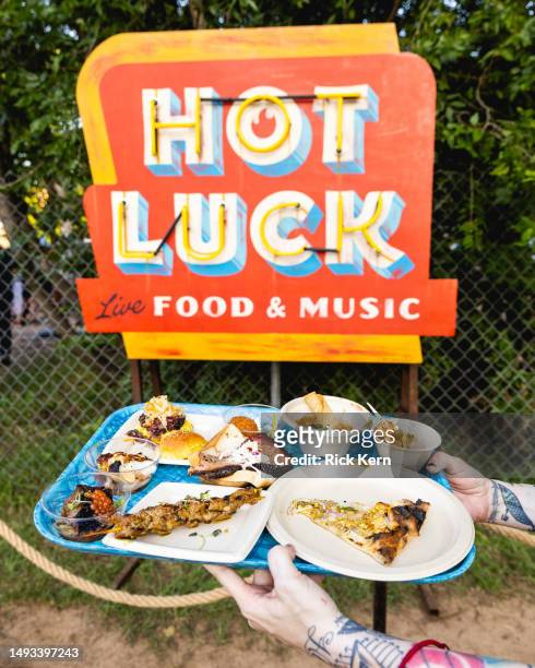 Tray containing food from multiple chefs is seen during the Hot Luck Live Food & Music Festival at Franklin Barbecue on May 25, 2023 in Austin, Texas.