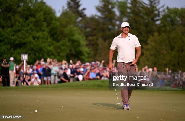 Brooks Koepka of the United States smiles on the 18th green before his final putt to win during the final round of the 2023 PGA Championship at Oak...