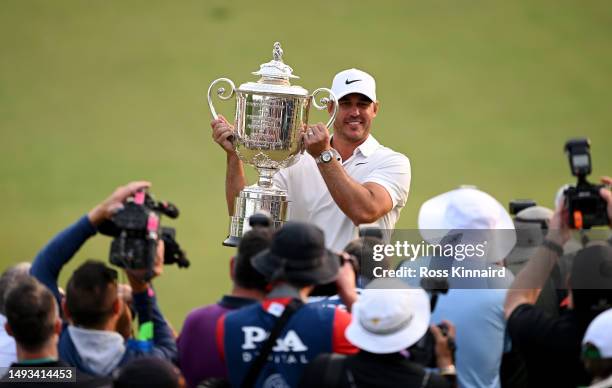 Champion Brooks Koepka holds The Wanamaker Trophy after the final round of the PGA Championship at Oak Hill Country Club on Sunday, May 21, 2023 in...