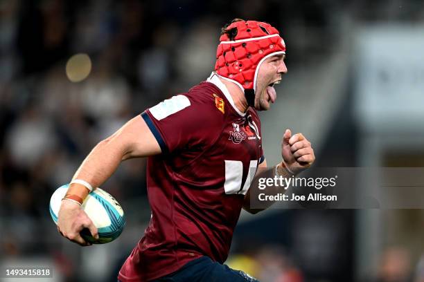 Harry Wilson of the Reds charges forward during the round 14 Super Rugby Pacific match between Highlanders and Queensland Reds at Forsyth Barr...