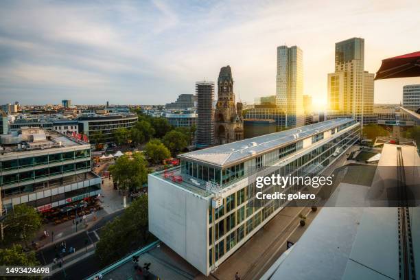 view over west berlin skyline with gedächtnis kirche at sunset - west berlin stock pictures, royalty-free photos & images
